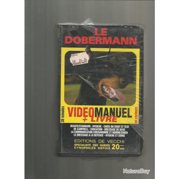 vhs et livre sur le dobermann
