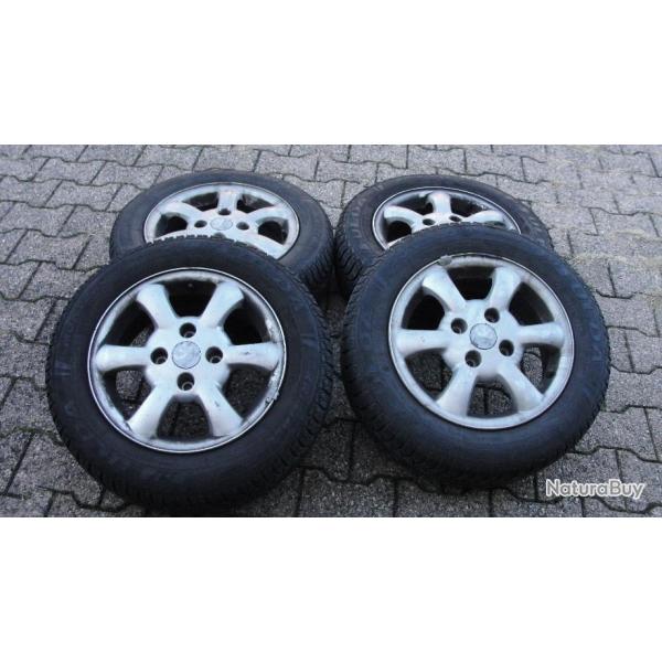 4 pneus neige fulda mont�s sur jantes ALU peugeot 206