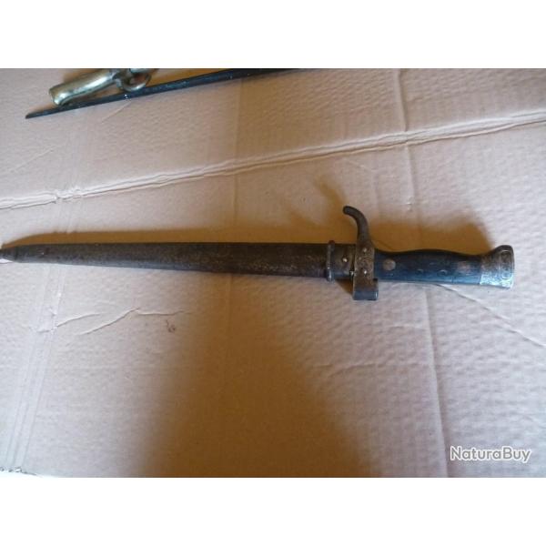 BAIO MOUSQUETON AVEC FOURREAU . LE BOUT DE LA BAIO EST COUPEE VOIR PHOTOS