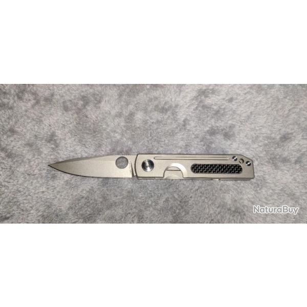 couteau pliant manche titane et carbone , lame acier D2