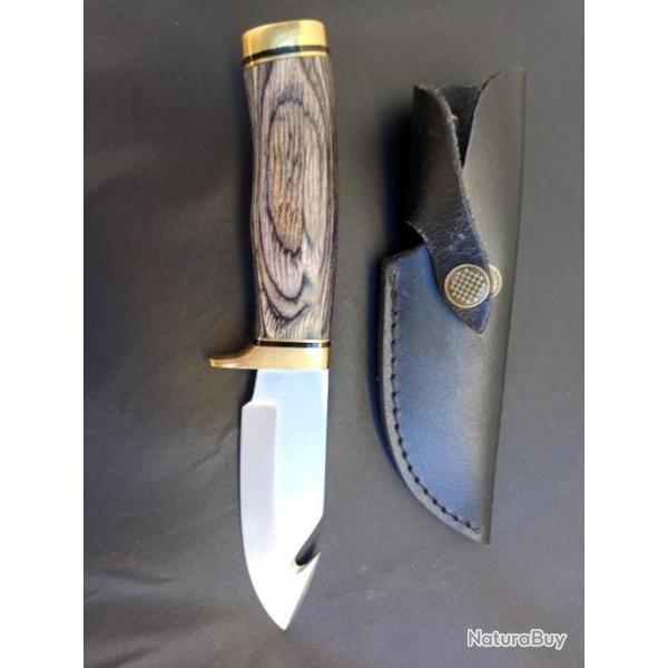 COUTEAU SKINNER  .  PARFAIT ETAT AVEC SON FOURREAU .  ACIER , BOIS , LAITON .   "   TRES COUPANT ."