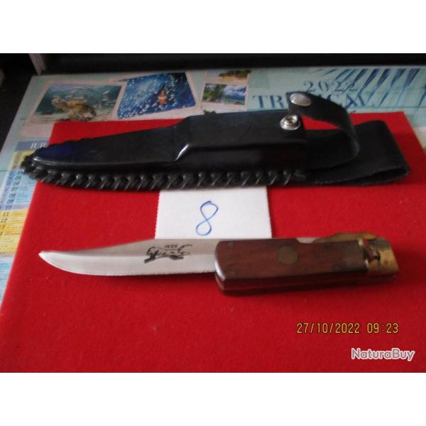 un couteau pliant avec etui noir tress� sur les bords