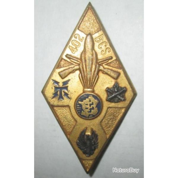 402� B.C.S, argent� et dor�, resine, dos guilloch� argent�