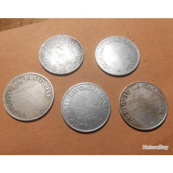 Un jeton Compagnie Le Taxiphone - diam 2,4 cm.