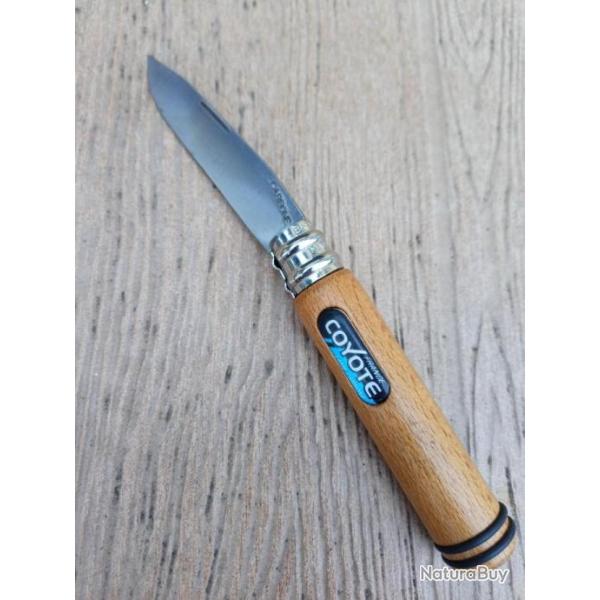 COUTEAU PLIANT  COYOTE  FRANCE  LAME CARBONE . AVEC TIRE BOUCHON  .  ETAT  NEUF .