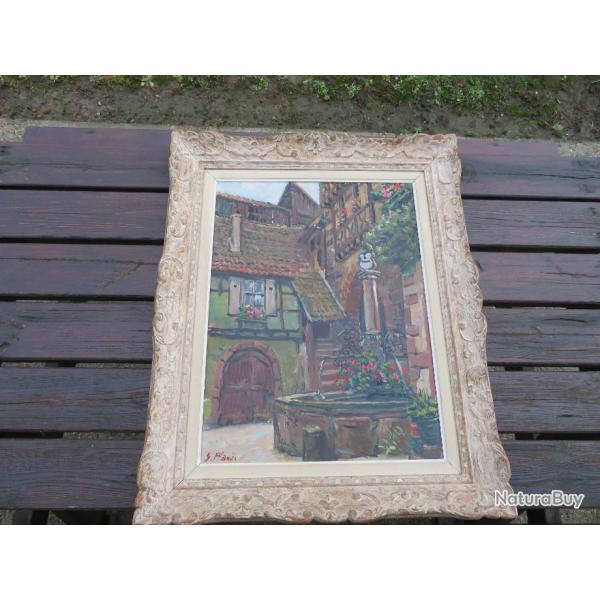 Huile sur panneau, repr�sentant des "Maisons Alsaciennes avec grande fontaine"sign�e Georges PLANES