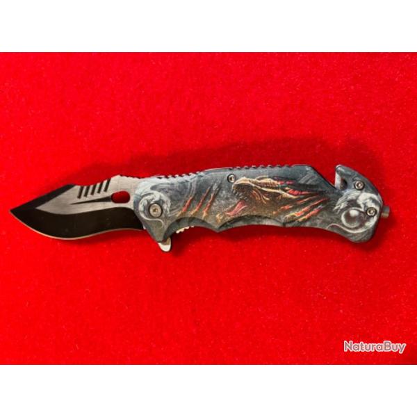 COUTEAU : OUVERTURE ET FERMETURE D'UNE MAIN, MOTIFS : TYRANNOSAURE.