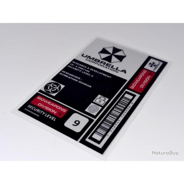 FIN R�DUCTION ! BADGE PLASTIFI� RESIDENT EVIL UMBRELLA CORPORATI0N BIOHAZARD.