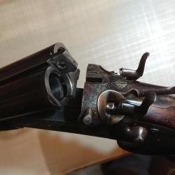 Vds un fusil cal 12 juxtapos&eacute; &agrave; chiens ext&eacute;rieurs  de 1905 &eacute;preuve poudre T en parfait &eacute;tat