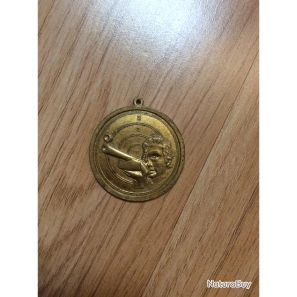 m�daille de tire en bronze dor� vintage