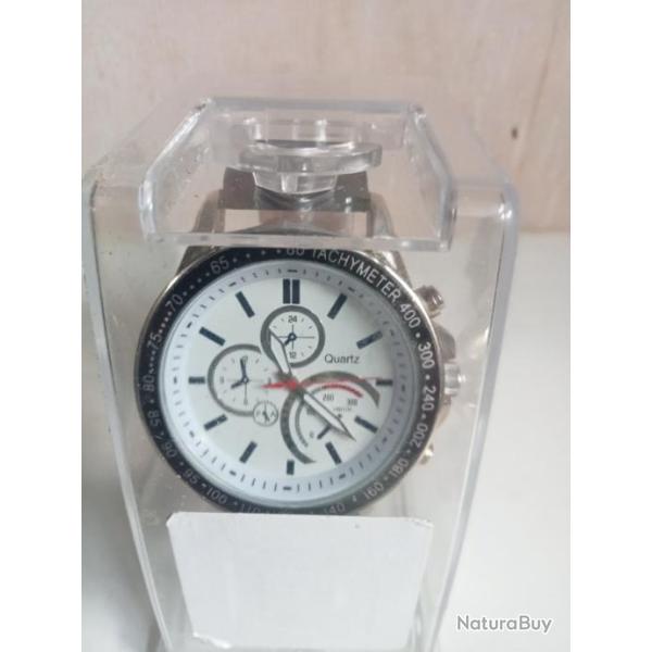 montre  neuf dans �a boite d'origine,pile remis a neuf