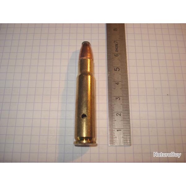 une cartouche de 356 winchester, neutralis�e, �tui perc�, amorce percut�e, ogive demi blind�e