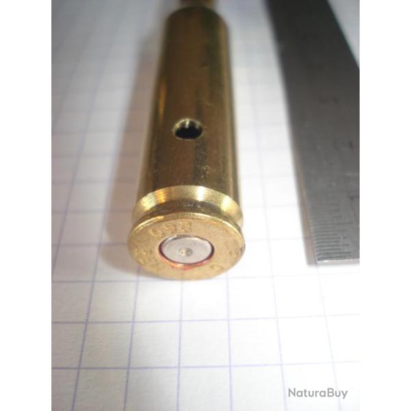 une cartouche de 260 remington demi blind�e, neutralis�e, perc�e, percut�e