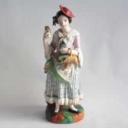 Tisanière porcelaine figurative Paysanne au pot à lait
