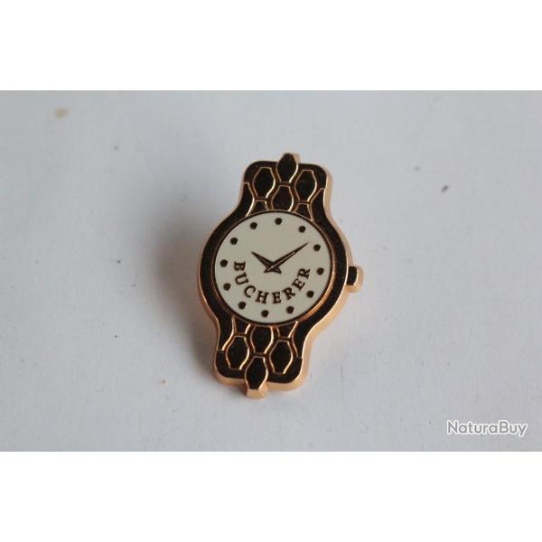 BUCHERER Pin's publicitaire Montre
