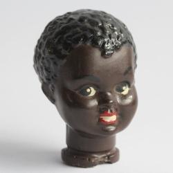 T&ecirc;te de Poupon noir