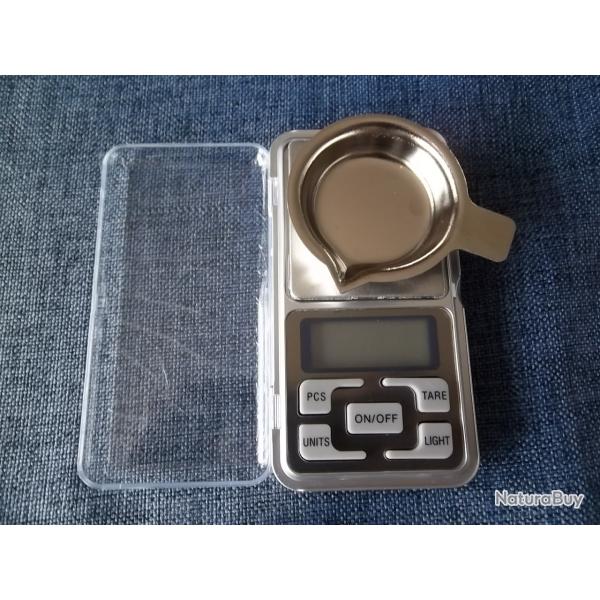 Balance avec poids de calibrage