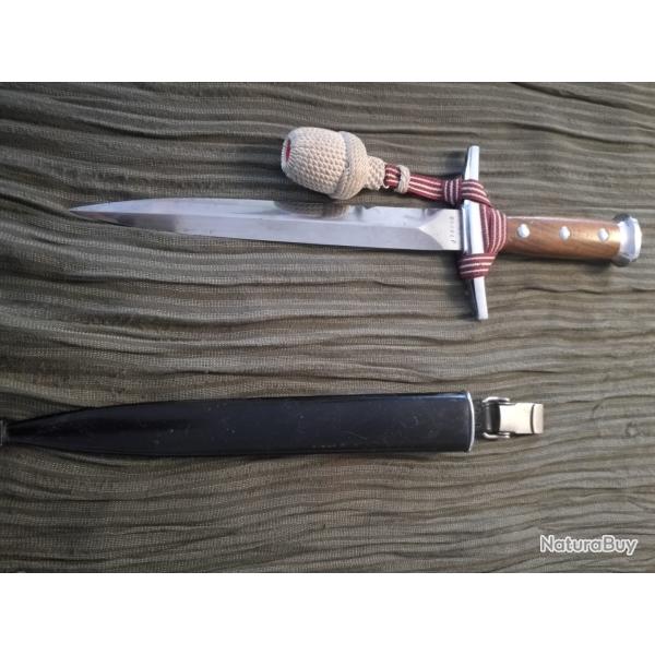 Dague d'Officier de l'Arm�e suisse Ann�es 70 Dragonne rouge avec fils de coton Gland blanc cass�.