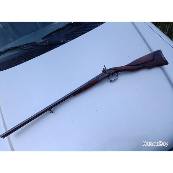 Fusil a percussion calibre 20 crosse sculpt�e
