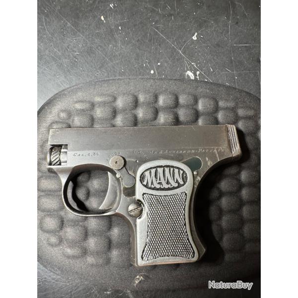 Ressort,pi�ce de recouvrement du m�canisme sous plaquettes de crosse pistolet fritz mann 6.35