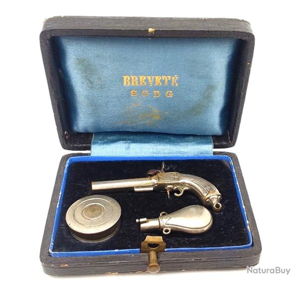PISTOLET A PERCUSSION MINIATURE + ACCESSOIRES EN COFFRET BREVETE S.G.D.G. Trs bon  XIX eme Belgique
