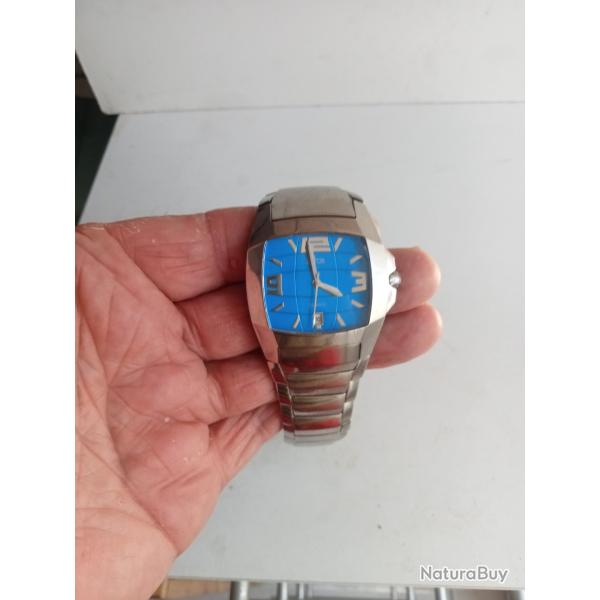 montre lotus a fond bleu pile remis � neuf