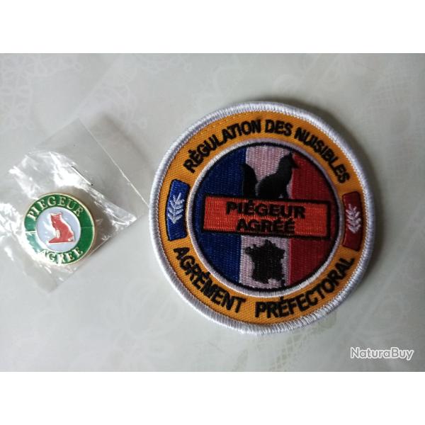 vend �cusson neuf brod� et petit badge pi�geur agr��