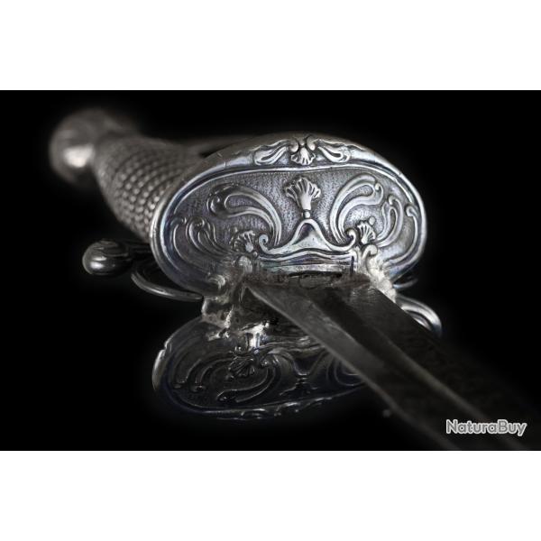 N29 - Epe de cour parisienne rocaille en argent par NR & Zess