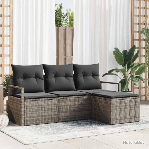 Ensemble de canap�s de jardin 4 pi�ces avec des coussins gris en poly rotin.