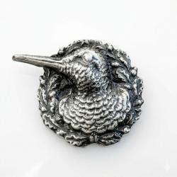 Insigne en m&eacute;tal repr&eacute;sentant une b&eacute;casse de profil   4a.