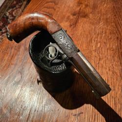 Pistolet à percussion, à système