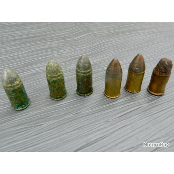 Lot de 7 munitions d'�poque pour revolver mod�le 1873 (calibre 11 mm)