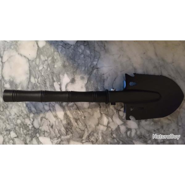 Pelle camping rando survie polyvalente ( scie, arrache clous , d�capsuleur , boussole ... )