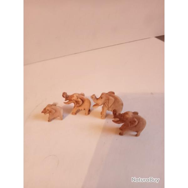lot de 4 sculptures �l�phants en materiaux noble d'Afrique le plus grand 4 x3 cm