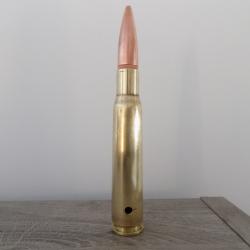 Cartouche calibre 12.7mm neutralis&eacute;e par per&ccedil;age.