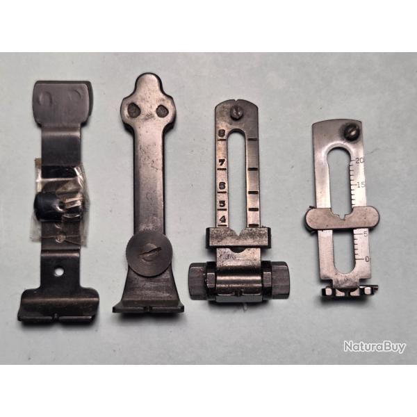 Un lot de quatre hausse de carabine genre Winchester et divers