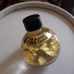 Flacon feuilles d'or 24 carats dans du liquide...(provenance USA)