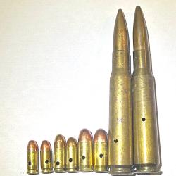 Lot de 8 munitions neutralis&eacute;es 2x 11.43, 2x 9mm para, 2x 7.65 et 2 x 12.7  perc&eacute;es vid&eacute;es percut&eacute;es