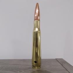 Cartouche calibre 12.7mm neutralis&eacute;e par per&ccedil;age.