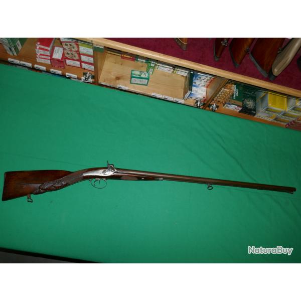 Fusil de chasse � percussion crosse grav�e avec une t�te de sanglier