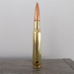 Cartouche calibre 12.7mm neutralis&eacute;e par per&ccedil;age.