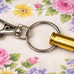 Porte clef avec balle de 9 mm neutralis&eacute;