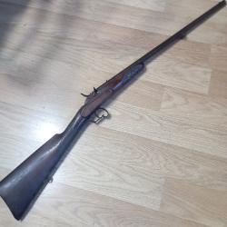 Ancienne carabine de jardin de type Flobert en 9mm FL avec un syst&egrave;me particulier de percussion.