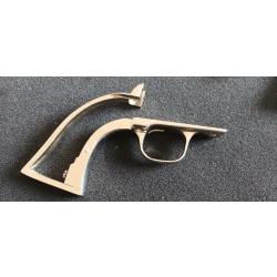 Backstrap et Tiggerguard nickel&eacute; pour colt 1873. Calibre inconnu.