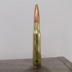 Cartouche calibre 12.7mm neutralis&eacute;e par per&ccedil;age.