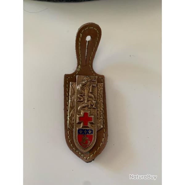 l'insigne de la 1�re Section d'Infirmiers Militaires (1�re SIM)