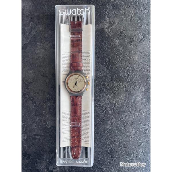 Swatch Chrono Goldfinger SCM100 - 1991 - Bo�te d'origine - �tat neuf