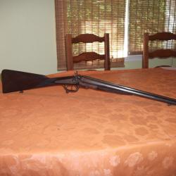 Fusil coach gun &agrave; chiens calibre 16/65 verrouillage sous pontet de 1898.