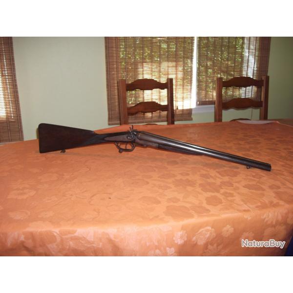 Fusil coach gun � chiens calibre 16/65 verrouillage sous pontet de 1898.