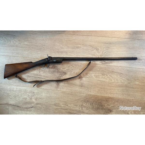 Fusil de braconnier pliant � un coup, calibre 20, syst�me � broche ; tr�s bon �tat d'origine.